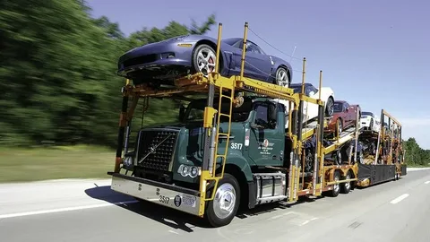 Professional car carrier truck transporting multiple vehicles